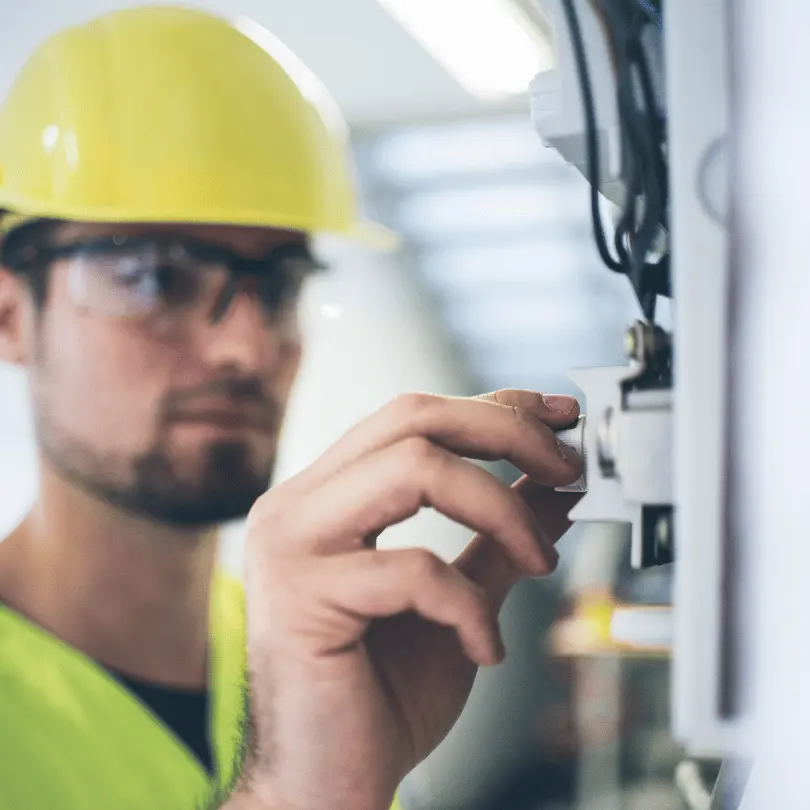 electrician inspecting the switchboard